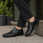 Men’s black formal slip-on shoes, model 6002, shown being worn